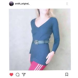 Divided. Blue V-neck sweater.